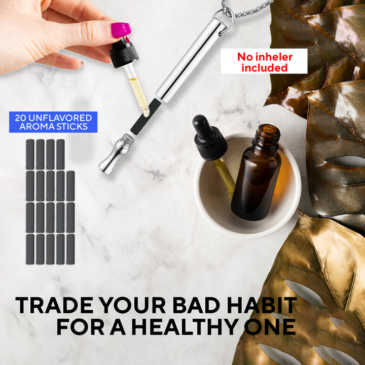 Inhaler necklace device with unflavored aroma sticks on a marble surface, promoting a healthier alternative.